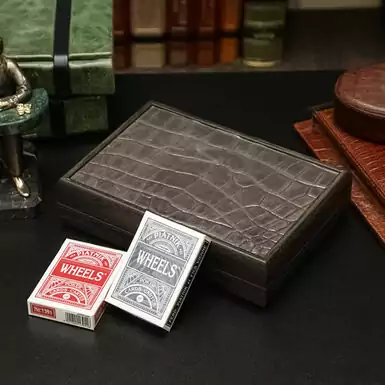 Playing cards in a crocodile leather case