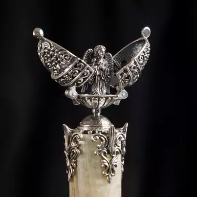 Easter egg "Guardian Angel" on a stand made of marble onyx