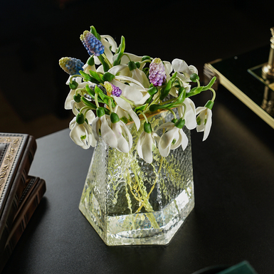 Bouquet of cold porcelain primroses in a Bohemian glass vase, author Marina Malinovskaya