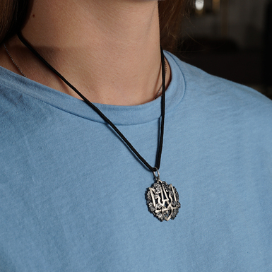 Silver pendant "Trident in the vine" on a cord