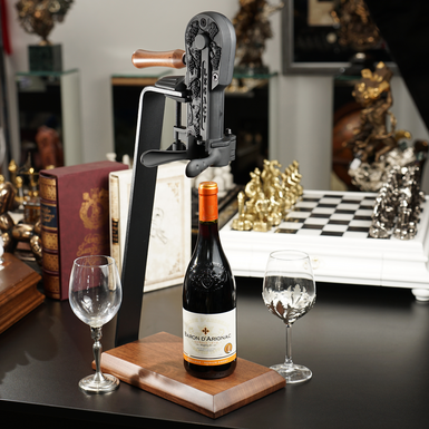 Replica of an antique corkscrew with walnut base and handle from Wine Enthusiast