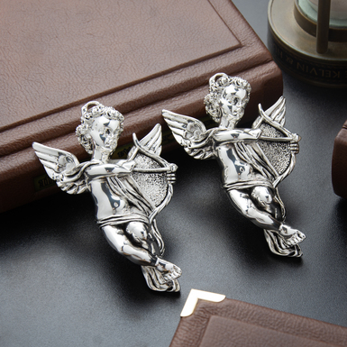 A set of two angels with Cupid made of marble chips and 925 sterling silver by Exetera Argenti 