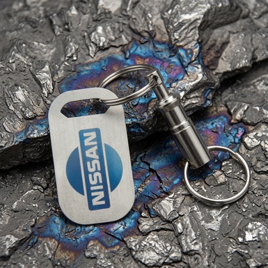 Титановий брелок "Nissan" полегшеної серії Light зі швейцарським карабіном "Victorinox"