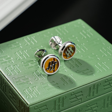 Montegrappa's "Materica" ​​stainless steel cufflinks with tiger's eye inlay