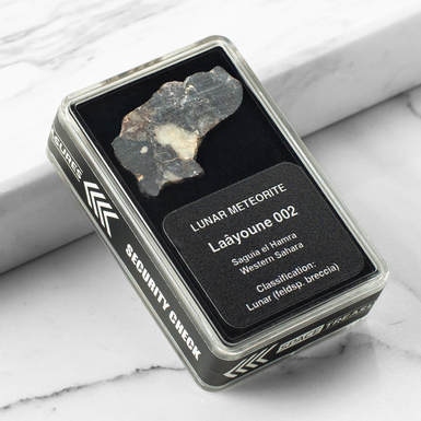 Certified meteorite "Laâyoune 002", 1,36 g (Western Sahara)